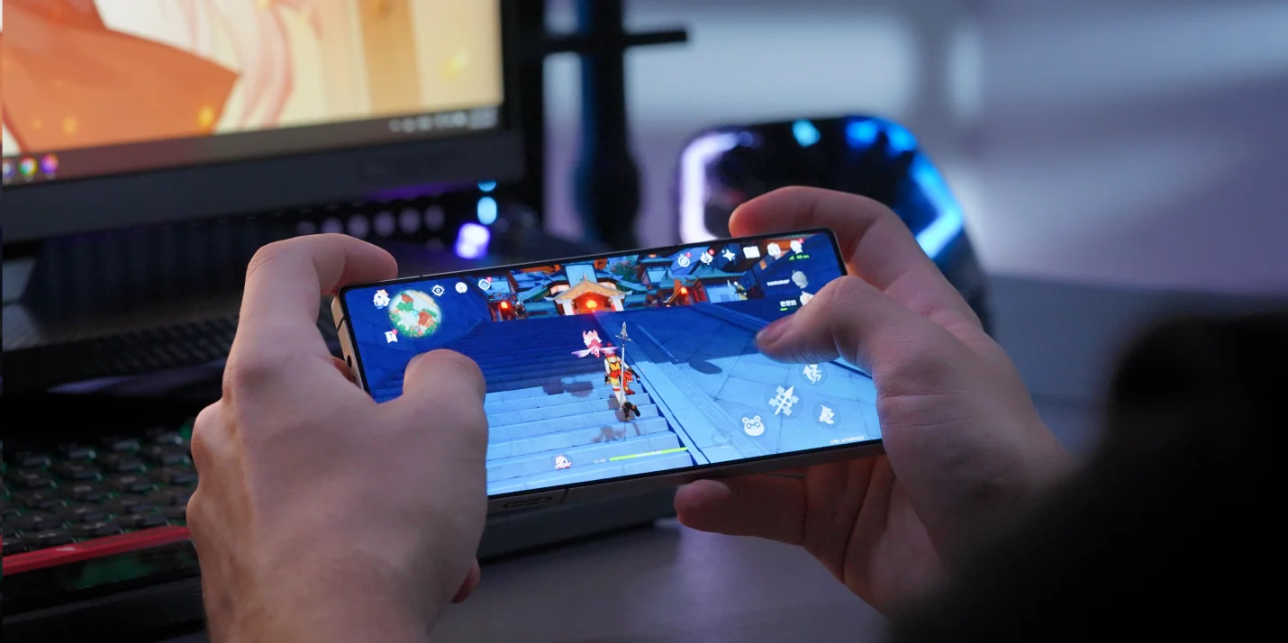 Mobile gaming demonstration shown on a smartphone screen during a technology showcase